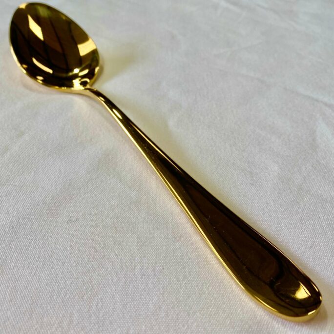 Gold serving spoon