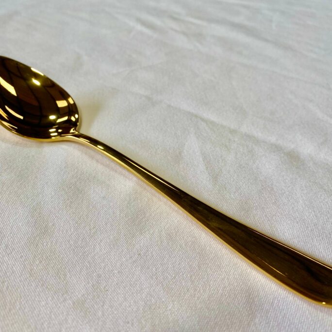 Gold dessert spoon